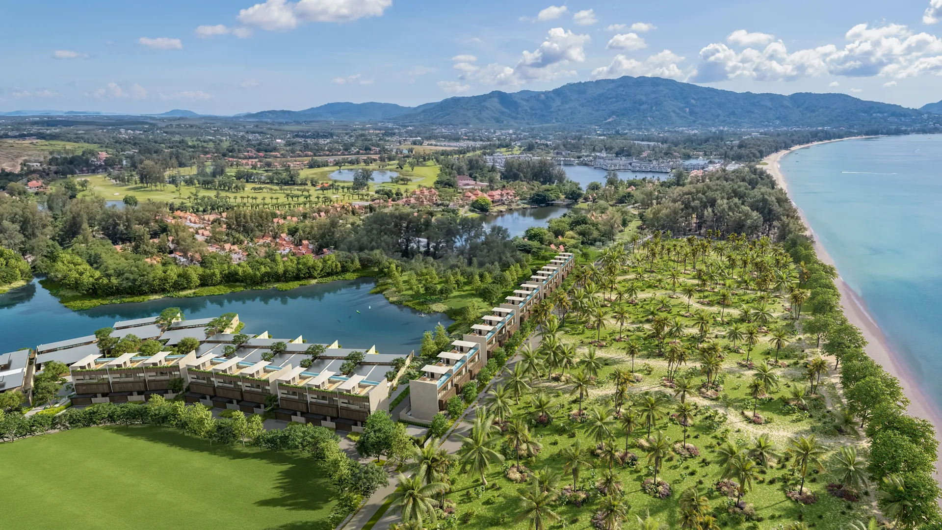 Banyan Tree Grand Residences Beach Terraces - A luxurious balcony at sunset, featuring seating, an infinity pool, overlooking a tropical ocean horizon with palm trees.