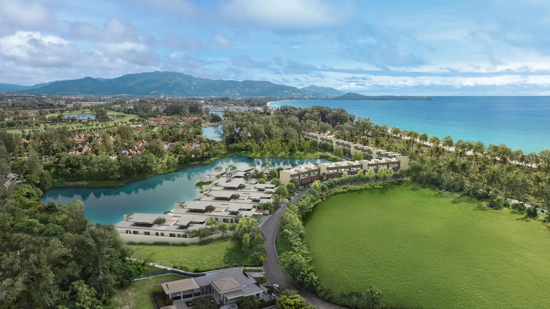 Banyan Tree Grand Residences Beach Terraces - A luxurious balcony at sunset, featuring seating, an infinity pool, overlooking a tropical ocean horizon with palm trees.